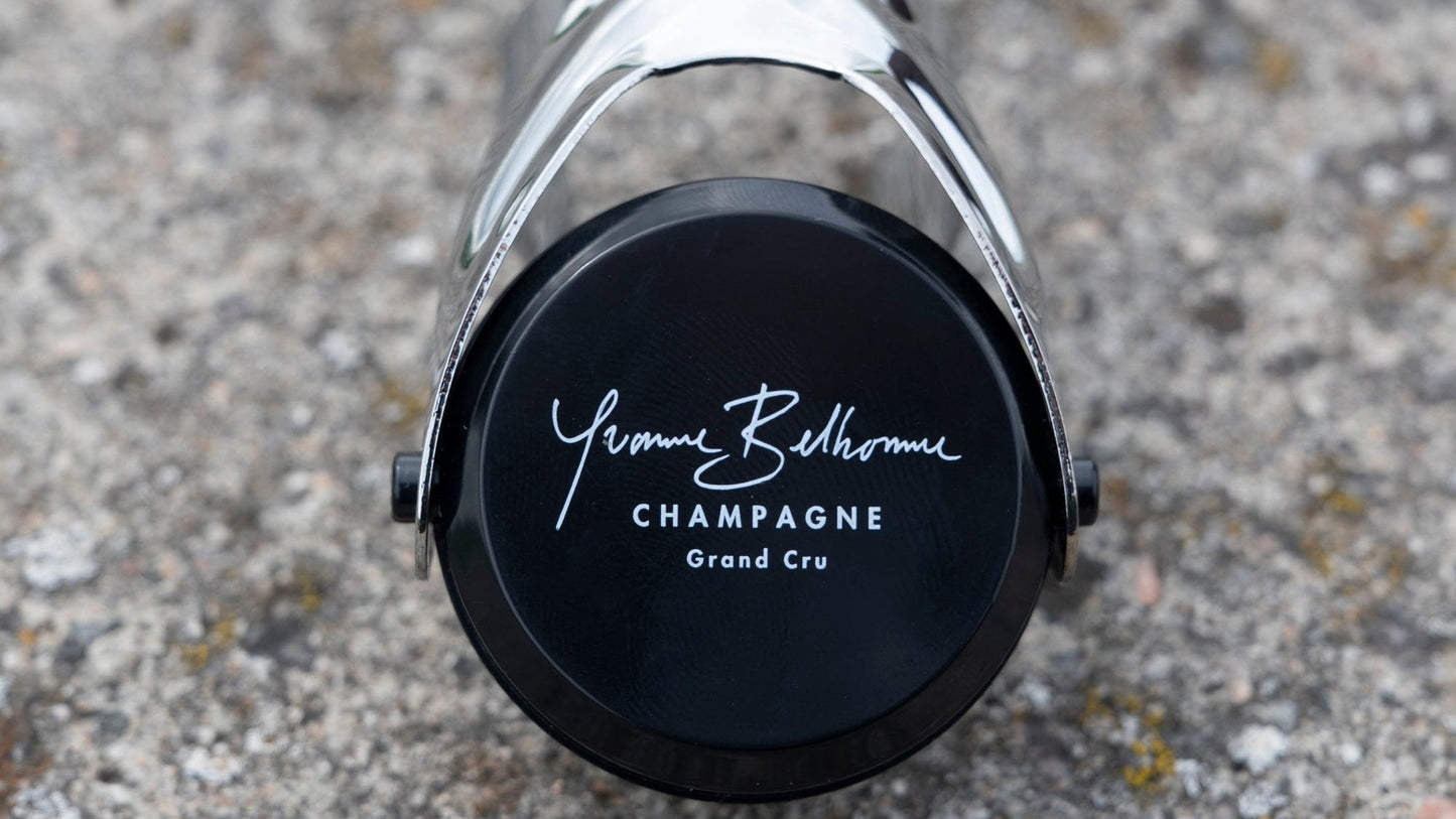 Yvonne Belhomme Champagne bottle  stopper close up on a textured surface