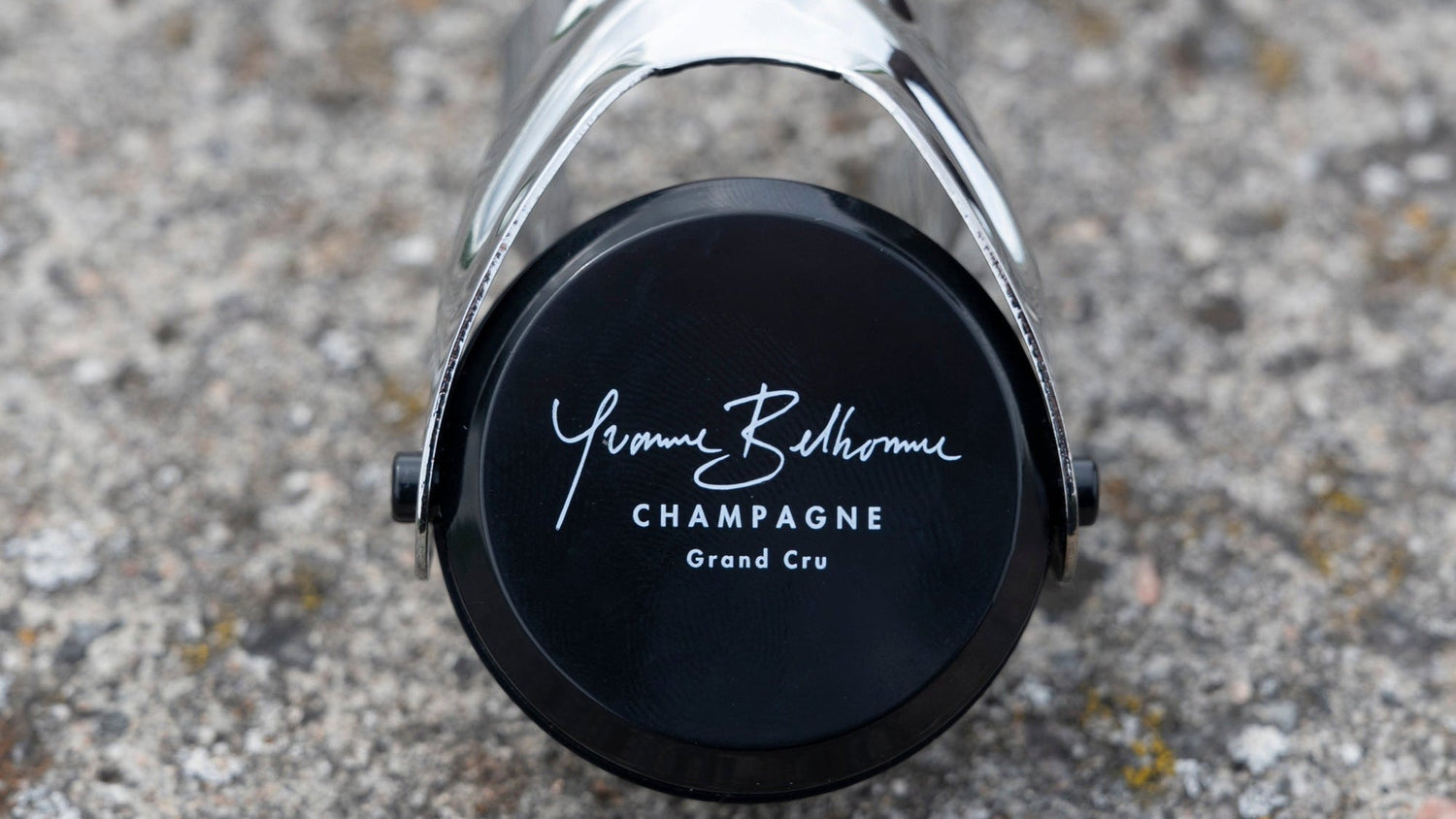 Yvonne Belhomme Champagne bottle  stopper close up on a textured surface