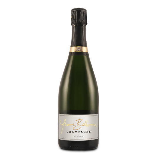 A bottle of Yvonne Belhomme Champagne with a label indicating it is a Grand Cru Brut champagne.